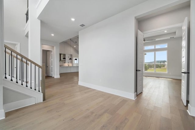 917 Bristol Creek Bnd, Lakeway, TX 78738 - foyer entrance featuring light wood-style floors, stairs, and recessed lighting