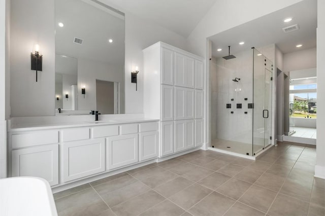 917 Bristol Creek Bnd, Lakeway, TX 78738 - full bath with a shower stall, tile patterned floors, vanity, and recessed lighting
