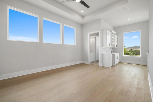 917 Bristol Creek Bnd, Lakeway, TX 78738 - unfurnished bedroom featuring light wood-style floors, a raised ceiling, recessed lighting, and a ceiling fan