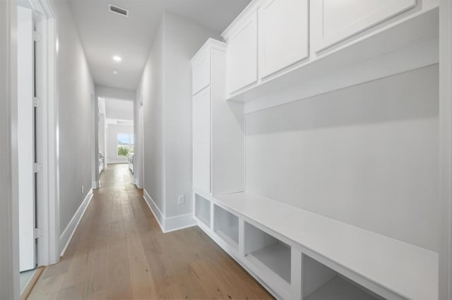 mudroom featuring recessed lighting, baseboards, visible vents, and light wood-type flooring