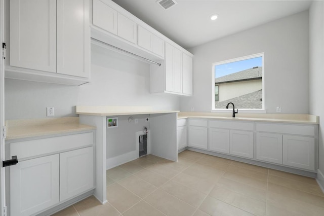 917 Bristol Creek Bnd, Lakeway, TX 78738 - washroom with cabinet space, washer hookup, light tile patterned floors, and recessed lighting