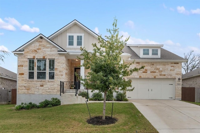 craftsman house featuring a garage and a front yard