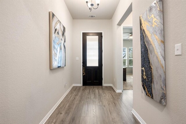 entryway featuring ceiling fan and hardwood / wood-style flooring