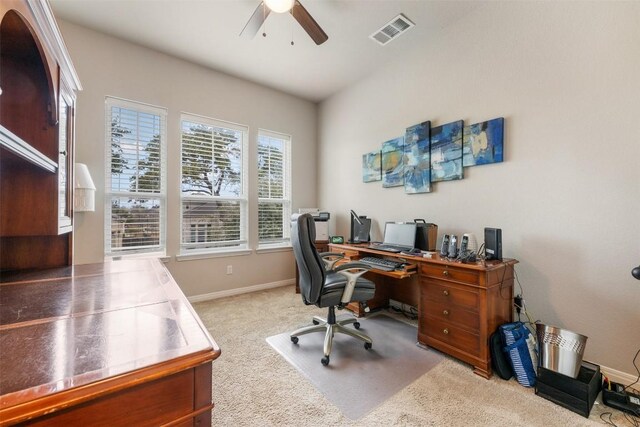 carpeted office with ceiling fan