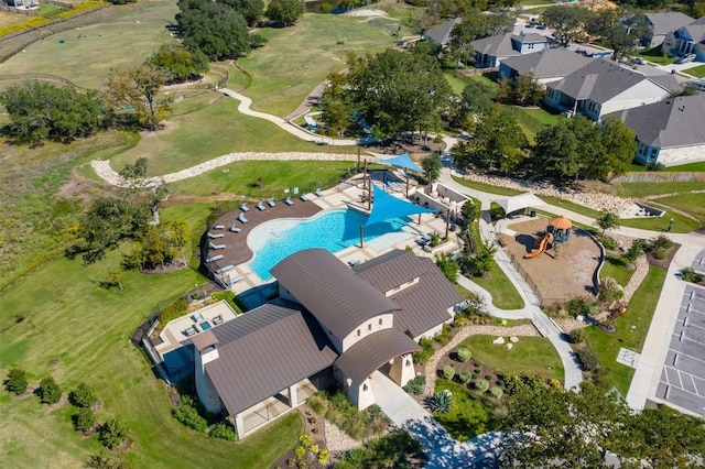 aerial view of property's location with a pool