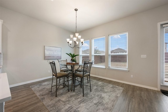 132 Ridgeview Ct, Georgetown, TX 78628 - dining room featuring dark wood-style floors, baseboards, and a chandelier