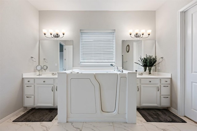 132 Ridgeview Ct, Georgetown, TX 78628 - bathroom featuring marble look tile flooring, vanity, a bath, and a chandelier