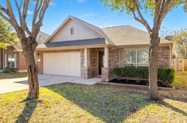 ranch-style home with a garage and a front yard