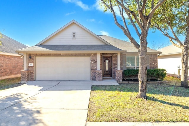 ranch-style home featuring a front lawn and a garage