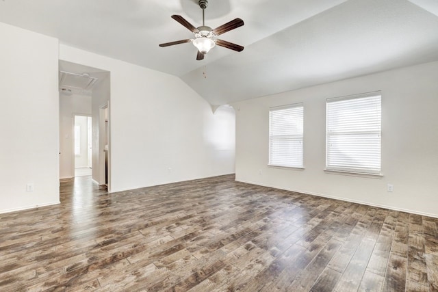 spare room featuring ceiling fan, dark hardwood / wood-style flooring, and lofted ceiling