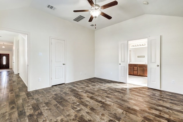 unfurnished bedroom featuring ceiling fan, dark hardwood / wood-style floors, and vaulted ceiling