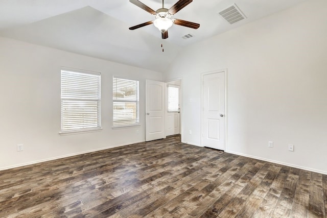 unfurnished room with ceiling fan, dark hardwood / wood-style flooring, a healthy amount of sunlight, and lofted ceiling