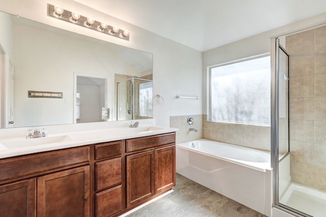 bathroom featuring vanity and independent shower and bath