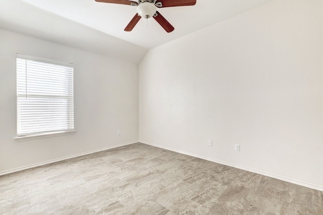 unfurnished room featuring ceiling fan, light colored carpet, and lofted ceiling