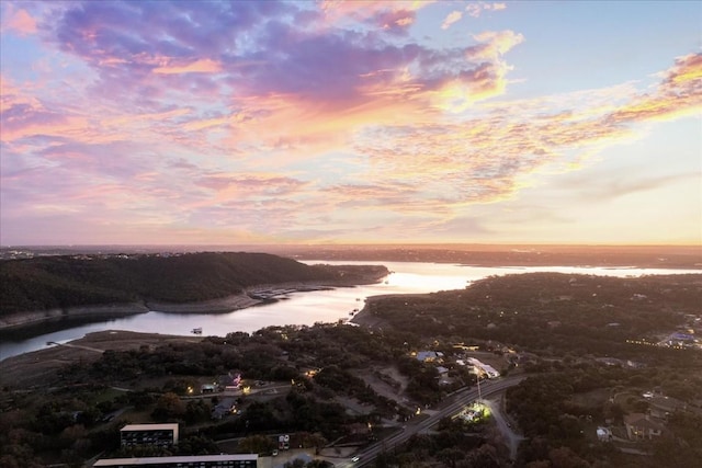 aerial view at dusk with a water view