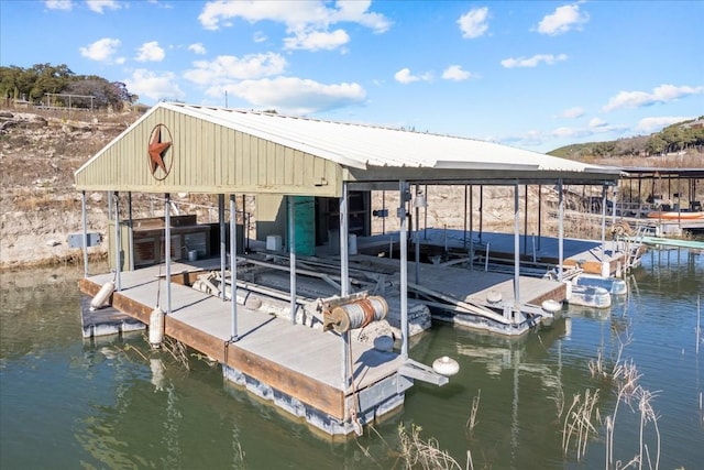 dock area featuring a water view and boat lift