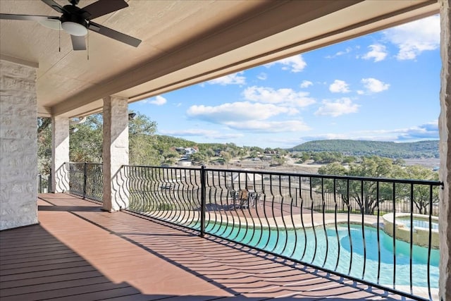 14273 Fm 2769, Leander, TX 78641 - wooden deck with ceiling fan, a pool with connected hot tub, and a mountain view