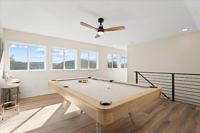 recreation room featuring ceiling fan, wood-type flooring, billiards, and a wealth of natural light