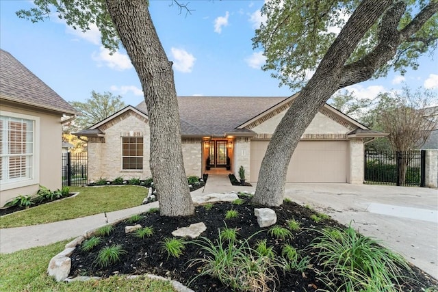 view of front facade featuring a garage, fence, concrete driveway, and roof with shingles