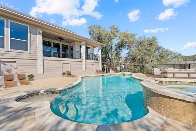 view of pool with a patio area, fence, an outdoor living space, and an in ground hot tub