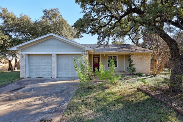 single story home with a front yard and a garage