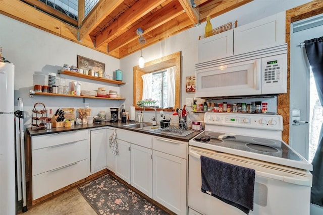 kitchen with sink, white cabinets, decorative light fixtures, and white appliances