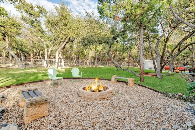 view of yard featuring an outdoor fire pit