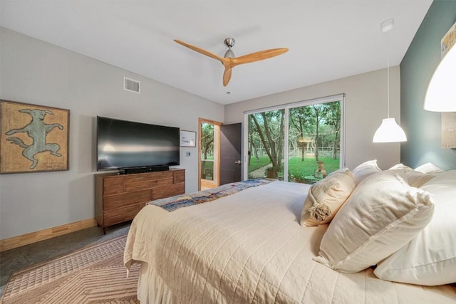 carpeted bedroom featuring access to outside and ceiling fan