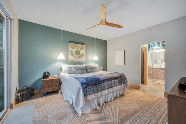 bedroom with ensuite bathroom and ceiling fan