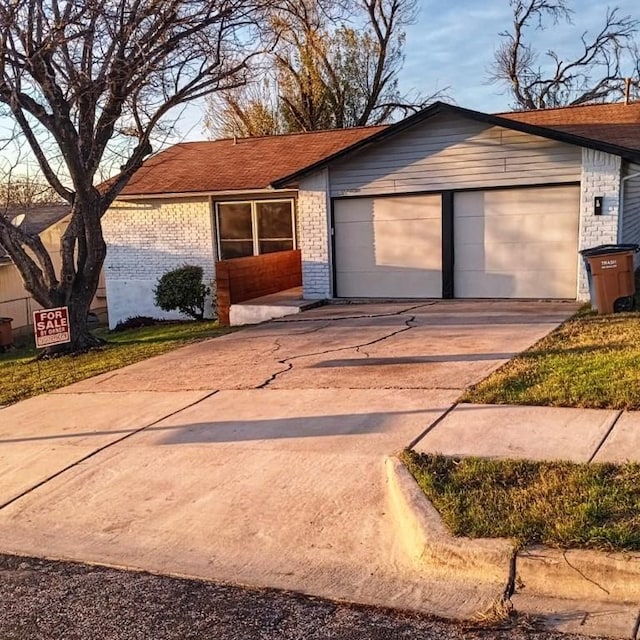 single story home with a garage