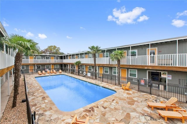 view of swimming pool with a patio