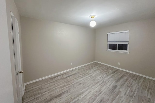 unfurnished room featuring light hardwood / wood-style floors