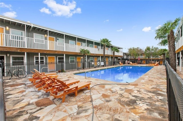 view of swimming pool with a patio