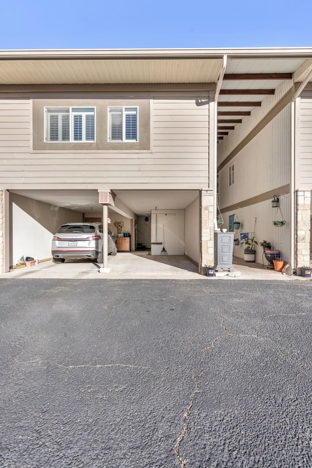 exterior space featuring a carport