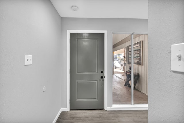 doorway with hardwood / wood-style floors