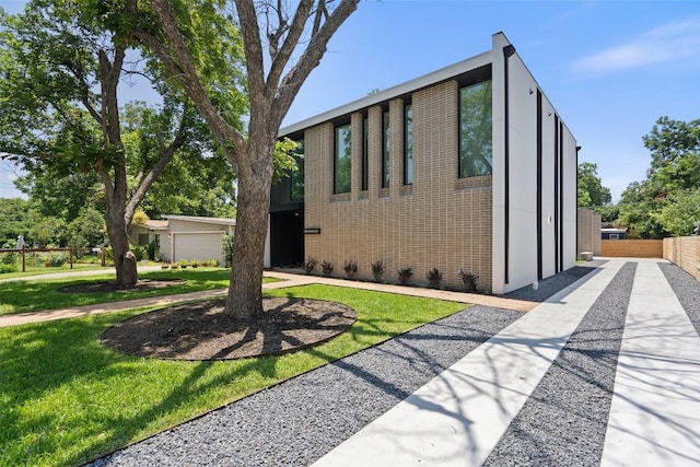 view of property exterior featuring a lawn