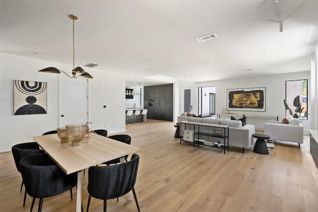 dining area with light hardwood / wood-style floors