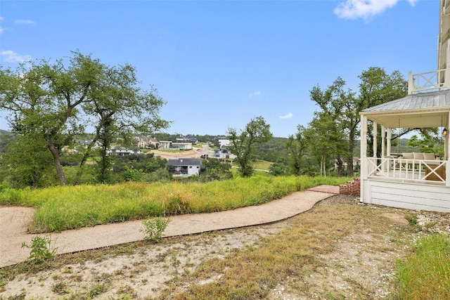 view of yard featuring covered porch