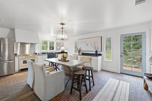 dining room featuring a chandelier and sink