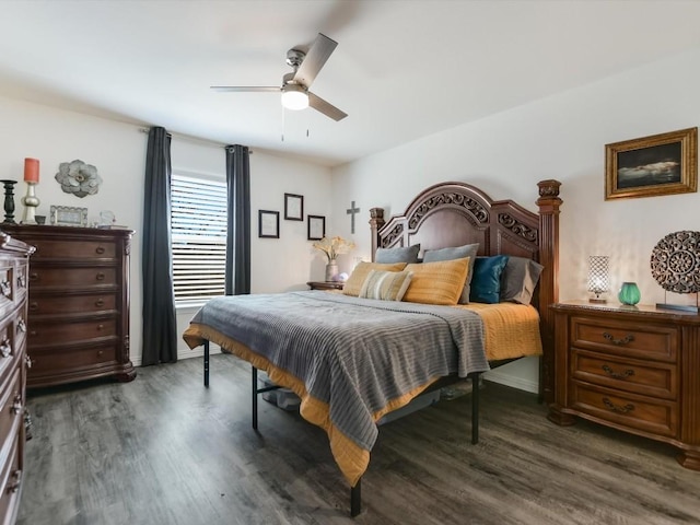 bedroom featuring ceiling fan and dark hardwood / wood-style floors