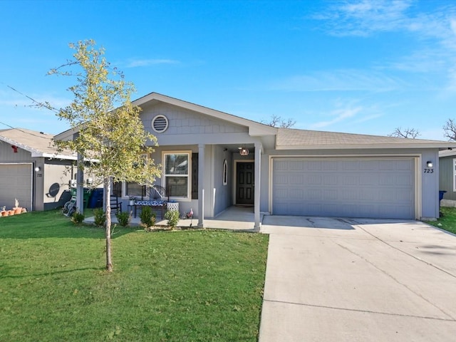 ranch-style house with a front lawn, a porch, and a garage