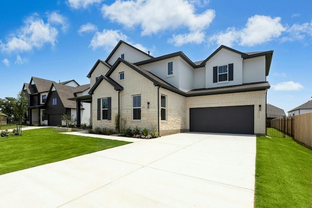220 Reata Ridge Loop, Liberty Hill, TX 78642 - view of front of house with a garage, brick siding, stucco siding, and driveway