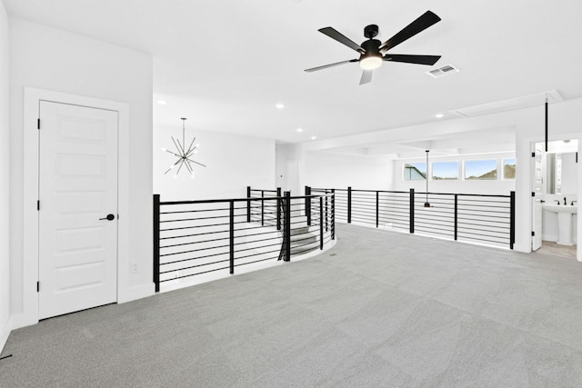 220 Reata Ridge Loop, Liberty Hill, TX 78642 - carpeted empty room with recessed lighting, ceiling fan, and a chandelier