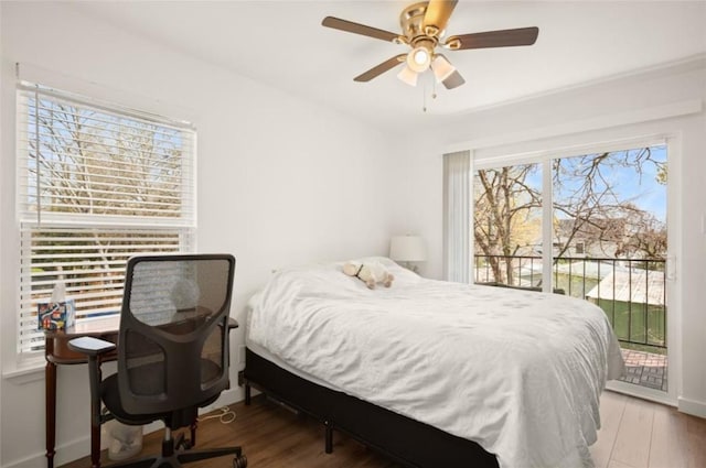 bedroom featuring access to outside, ceiling fan, and wood-type flooring