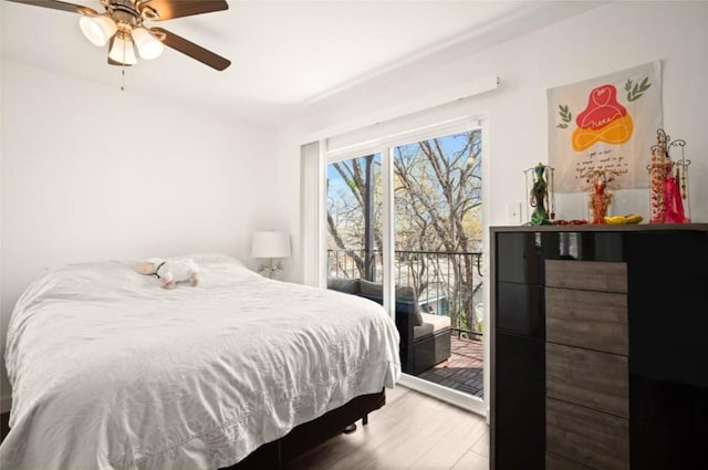 bedroom with access to outside, ceiling fan, and hardwood / wood-style flooring