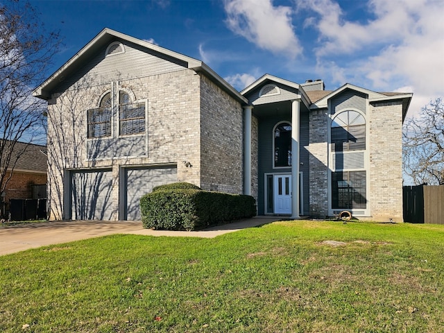 front of property with a front yard and a garage