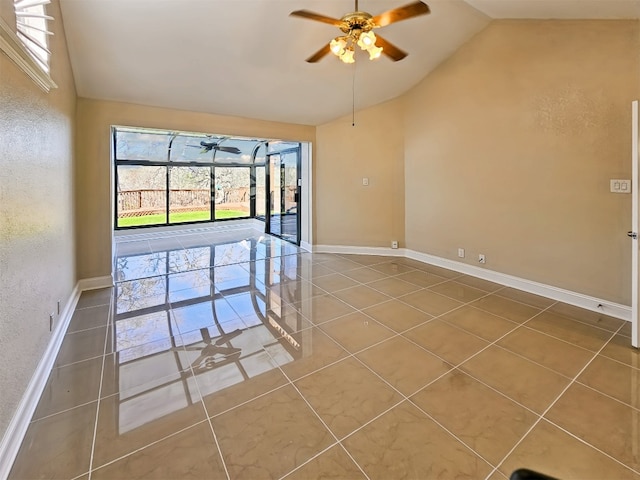 empty room featuring ceiling fan, tile patterned flooring, and vaulted ceiling