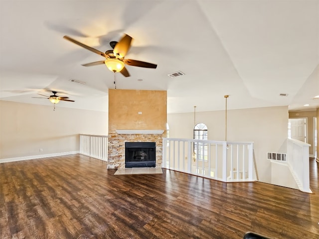 unfurnished living room featuring dark hardwood / wood-style flooring and a fireplace