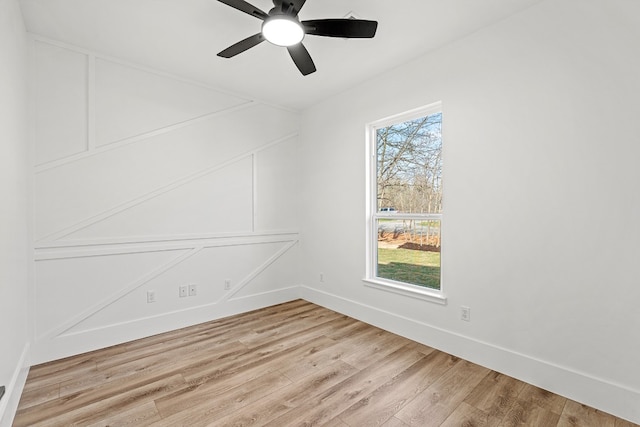 spare room with ceiling fan and light hardwood / wood-style floors