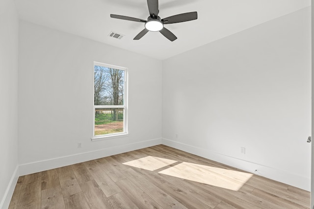 unfurnished room with ceiling fan and light wood-type flooring